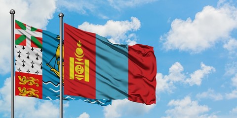 Saint Pierre And Miquelon and Mongolia flag waving in the wind against white cloudy blue sky together. Diplomacy concept, international relations.
