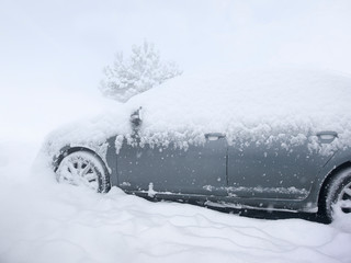 cold winter with lots of snow and cars stuck in it