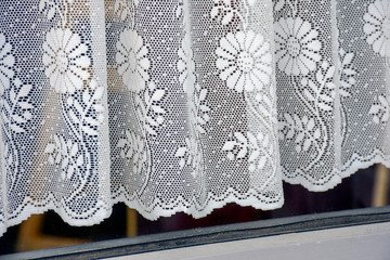 vintage background with lace curtains suggests grandma's house.