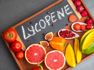 Fruits and vegetables containing lycopene. Healthy vegan food background. Lycopene is a red...