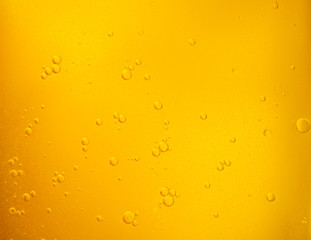 Bubbles on beer background. Oil drop shape on yellow background.Golden circle bubble water pattern.