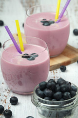 Two glasses with blueberry yogurt	