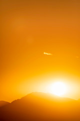 Glowing Sun Rising over Horizon,