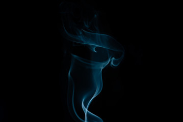 Movement of white smoke isolated on black background.Abstract shape and curve of smoke.