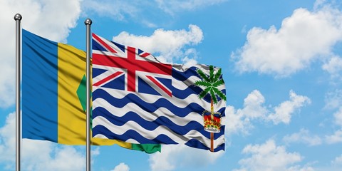 Saint Vincent And The Grenadines and British Indian Ocean Territory flag waving in the wind against...
