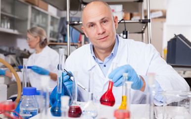 Lab technician working with reagents