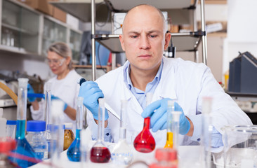 Biochemist analyzing chemical agents