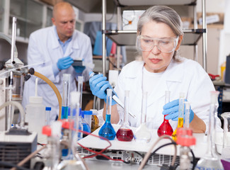 Female scientist working with reagents