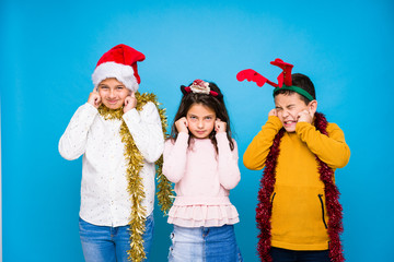 Kids celebrating crhistmas day doing expressions