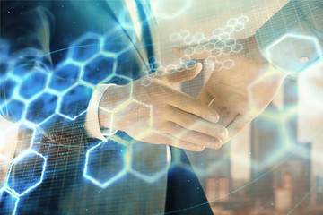Obraz na płótnie Canvas Double exposure of abstract technology drawing on cityscape background with two businessmen handshake. Concept of tech role in business