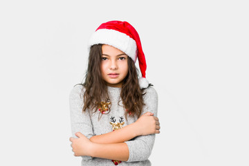 Little girl celebrating christmas day going cold due to low temperature or a sickness.
