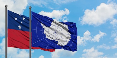 Samoa and Antarctica flag waving in the wind against white cloudy blue sky together. Diplomacy...