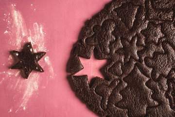 Fototapeta na wymiar Baking chocolate Christmas cookies Gingerbread dough and shapes