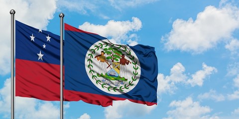 Samoa and Belize flag waving in the wind against white cloudy blue sky together. Diplomacy concept, international relations.
