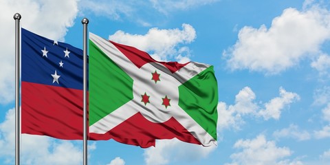 Samoa and Burundi flag waving in the wind against white cloudy blue sky together. Diplomacy...