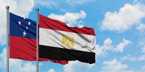 Samoa and Egypt flag waving in the wind against white cloudy blue sky together. Diplomacy concept,...