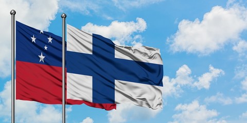 Samoa and Finland flag waving in the wind against white cloudy blue sky together. Diplomacy concept, international relations.