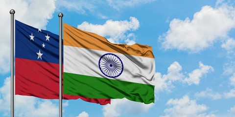 Samoa and India flag waving in the wind against white cloudy blue sky together. Diplomacy concept,...