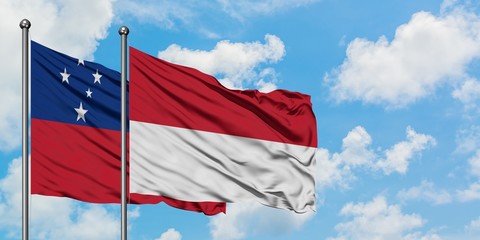 Samoa and Indonesia flag waving in the wind against white cloudy blue sky together. Diplomacy...