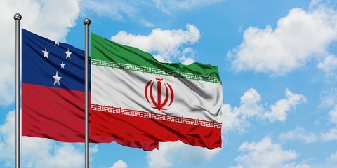Samoa and Iran flag waving in the wind against white cloudy blue sky together. Diplomacy concept,...
