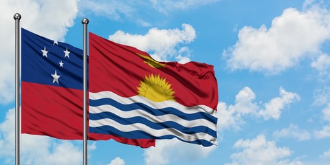 Samoa and Kiribati flag waving in the wind against white cloudy blue sky together. Diplomacy concept, international relations.