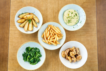 Different side dishes. Variety of dishes on the table. Restaurant menu.