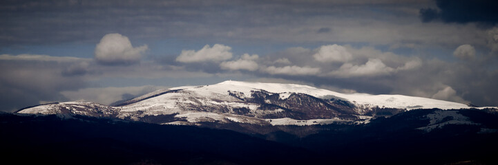 Fototapeta na wymiar panorama of a snowy mountain peak
