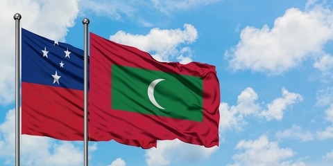 Samoa and Maldives flag waving in the wind against white cloudy blue sky together. Diplomacy concept, international relations.