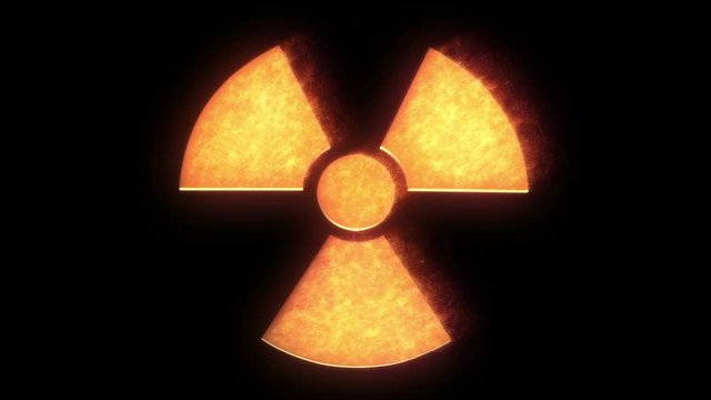 Radioactive symbol on fire with black background.