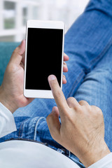 Online order and express delivery service food shopping concept on touch screen which hand's man holding smart phone lying on sofa at home background. Lifestyle in city.