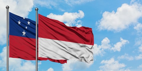 Samoa and Monaco flag waving in the wind against white cloudy blue sky together. Diplomacy concept, international relations.