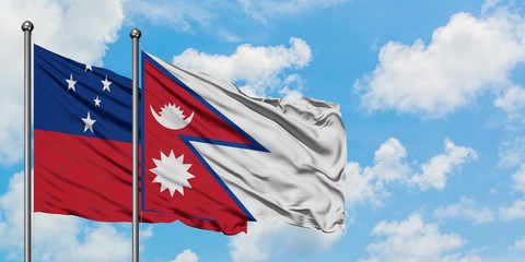 Samoa and Nepal flag waving in the wind against white cloudy blue sky together. Diplomacy concept,...