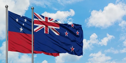 Samoa and New Zealand flag waving in the wind against white cloudy blue sky together. Diplomacy...