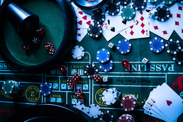 Casino background, poker Chips on gaming table, roulette wheel in motion,