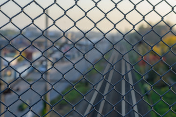 fence net behind which rail