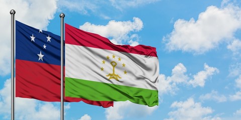 Samoa and Tajikistan flag waving in the wind against white cloudy blue sky together. Diplomacy...