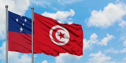 Samoa and Tunisia flag waving in the wind against white cloudy blue sky together. Diplomacy concept, international relations.