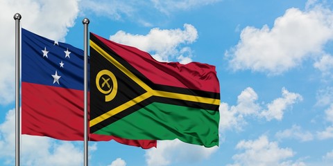 Samoa and Vanuatu flag waving in the wind against white cloudy blue sky together. Diplomacy...