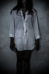 Close up woman wear white shirt in the dark room,Scary movie concept,Horror background,Thailand...