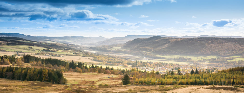 Fall landscape in Perthshire in Scotland. Orange color. River scene. Autumnal scene with colorful trees and river in the highlands in Scotland.