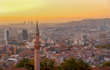 The single minaret from Ankara Castle and Ankara landscape in background in evening