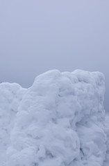 Fototapeta na wymiar Wall made of snow on rural field