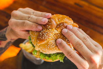 young man with hamburger
