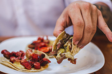 young man with tacos