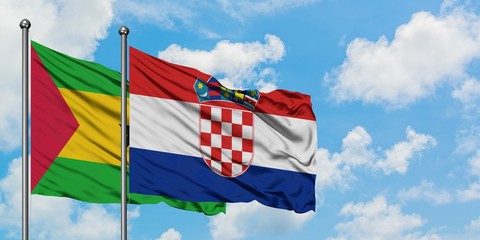 Sao Tome And Principe and Croatia flag waving in the wind against white cloudy blue sky together. Diplomacy concept, international relations.