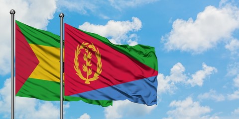 Sao Tome And Principe and Eritrea flag waving in the wind against white cloudy blue sky together. Diplomacy concept, international relations.