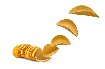 Potato crisps flying up, isolated on white background with copy space for text or images. Crispy, palatable chips. Advertising. Close-up.