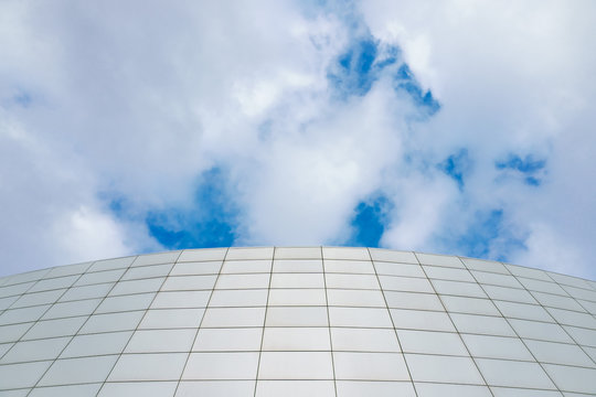 Wall of gray slabs against the sky