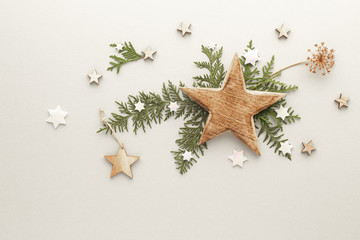 Fototapeta na wymiar Christmas composition. Star gift pine branches top view background with copy space for your text. Flat lay.