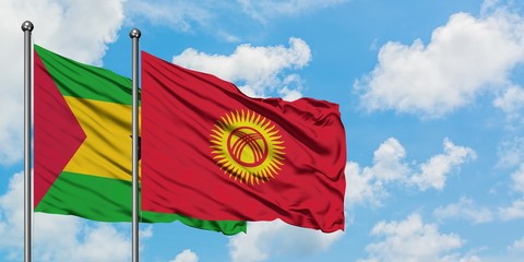 Sao Tome And Principe and Kyrgyzstan flag waving in the wind against white cloudy blue sky together. Diplomacy concept, international relations.